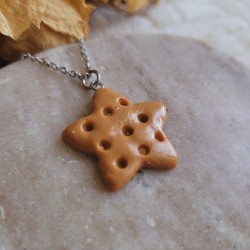 Pendentif biscuit forme étoile.