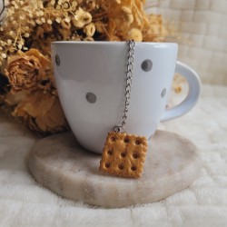 Boule à thé biscuit sablé carré en résine.