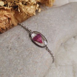 Bracelet pendentif minimaliste en acier inoxydable réalisé à partir de fleurs séchées.