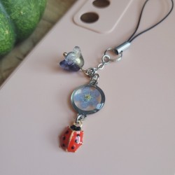 Bijoux de téléphone pendentif rond avec fleur séchée de Myosotis.