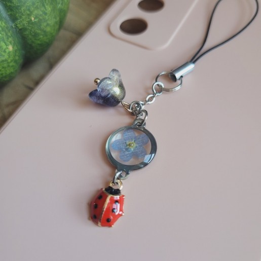 Bijoux de téléphone pendentif rond avec fleur séchée de Myosotis.