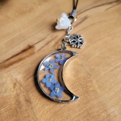 Bijoux de téléphone spécial Noël avec pendentif lune et fleurs séchées de Myosotis.